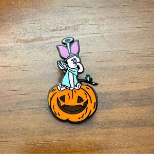 Piglet sitting on a pumpkin Halloween loungefly pin